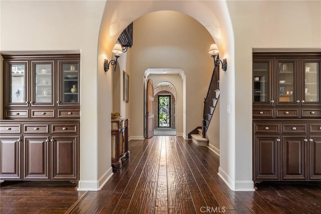 3 Observatory, Newport Coast, CA 92657 - foyer featuring arched walkways, dark wood-type flooring, and baseboards