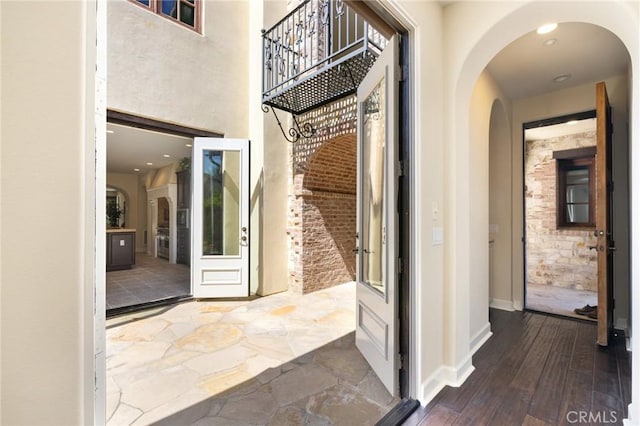 3 Observatory, Newport Coast, CA 92657 - hallway with arched walkways, baseboards, and wood finished floors