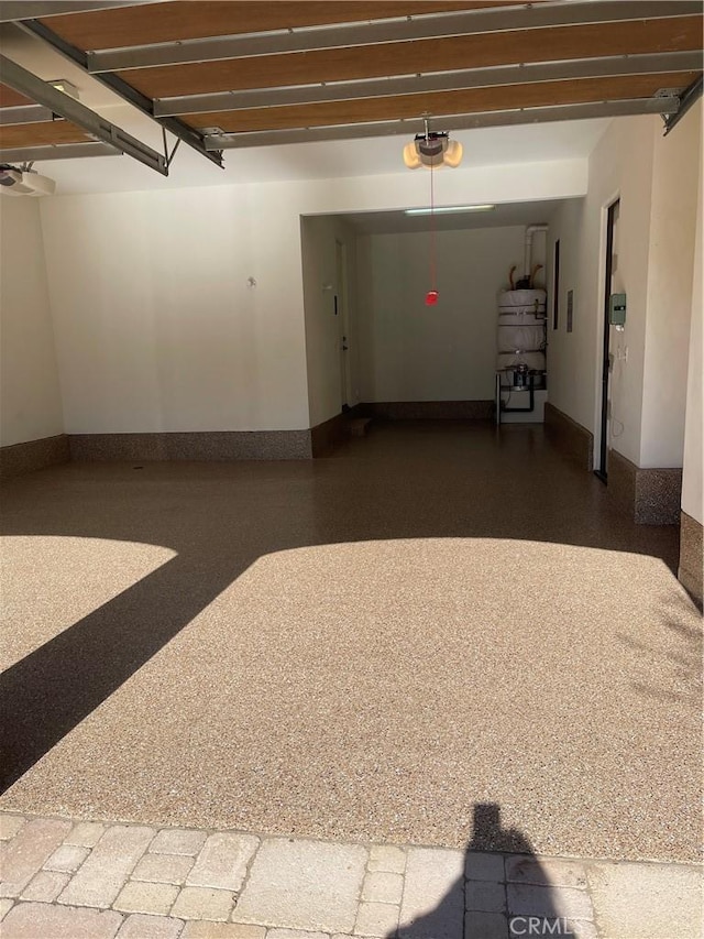 3 Observatory, Newport Coast, CA 92657 - garage featuring a garage door opener and baseboards
