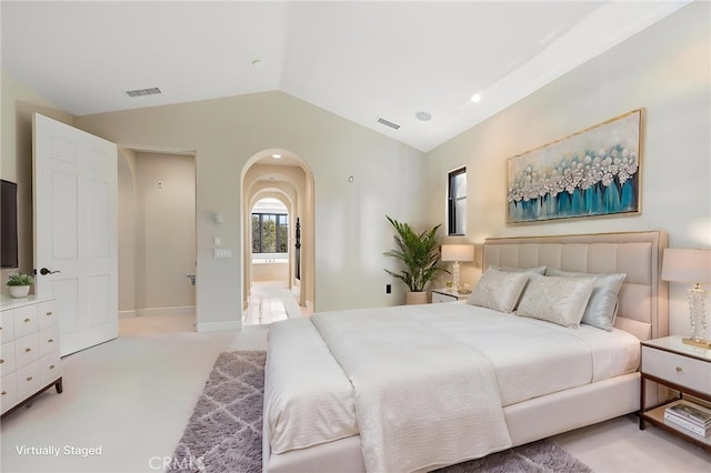 3 Observatory, Newport Coast, CA 92657 - bedroom with arched walkways, lofted ceiling, light carpet, and connected bathroom
