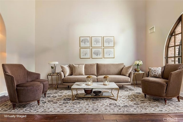 3 Observatory, Newport Coast, CA 92657 - living area featuring wood finished floors, arched walkways, and baseboards
