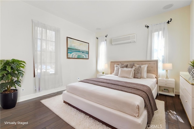 3 Observatory, Newport Coast, CA 92657 - bedroom with an AC wall unit, dark wood finished floors, and baseboards