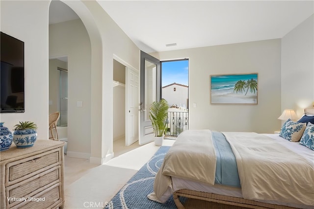 3 Observatory, Newport Coast, CA 92657 - bedroom with arched walkways, access to outside, and light colored carpet