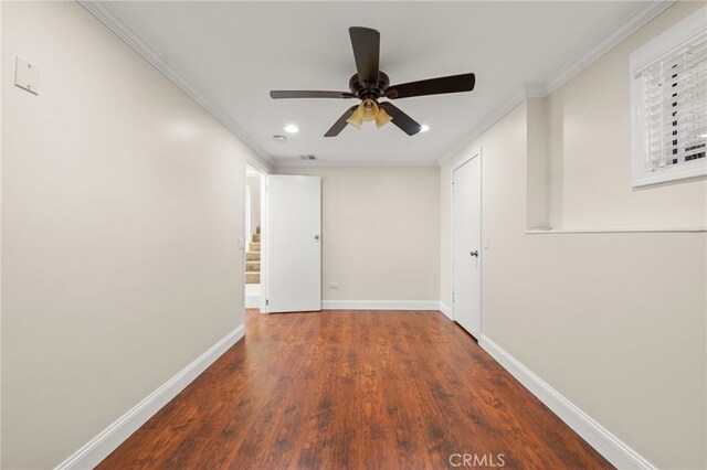 corridor featuring recessed lighting, baseboards, ornamental molding, and wood finished floors