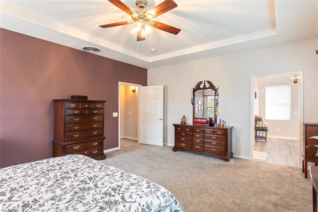 2845 Keystone Cir, Corona, CA 92882 - carpeted bedroom with a raised ceiling, baseboards, and ceiling fan