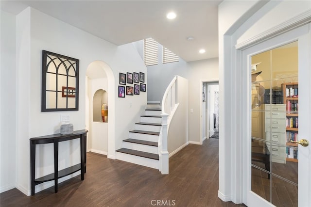 2845 Keystone Cir, Corona, CA 92882 - staircase featuring wood finished floors, arched walkways, baseboards, and recessed lighting