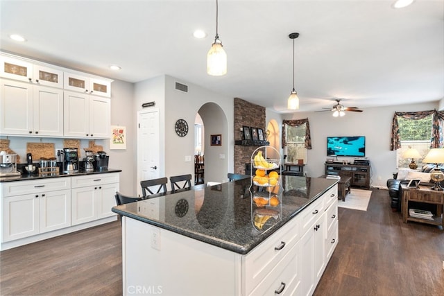 2845 Keystone Cir, Corona, CA 92882 - kitchen featuring arched walkways, a ceiling fan, open floor plan, dark wood finished floors, and recessed lighting