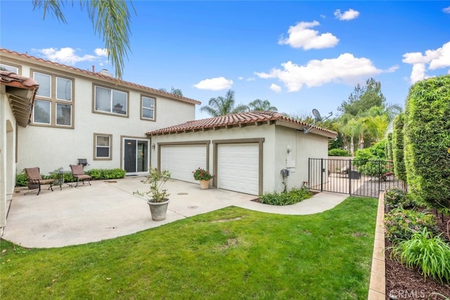 2845 Keystone Cir, Corona, CA 92882 - back of house with stucco siding, a tiled roof, a garage, concrete driveway, and a patio area
