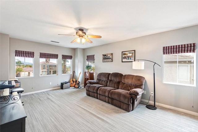 2845 Keystone Cir, Corona, CA 92882 - carpeted living room with a ceiling fan, healthy amount of natural light, and baseboards