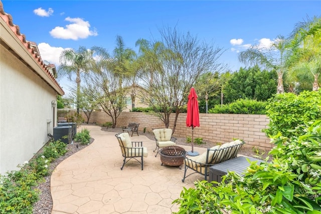 2845 Keystone Cir, Corona, CA 92882 - fenced backyard with an outdoor fire pit, central AC, and a patio