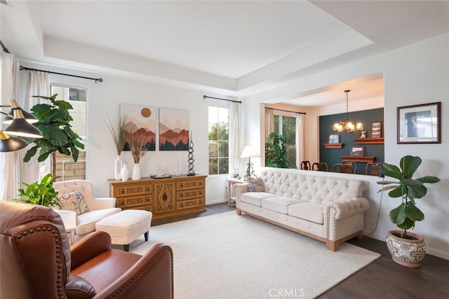 2845 Keystone Cir, Corona, CA 92882 - living area featuring a chandelier, wood finished floors, a raised ceiling, and baseboards