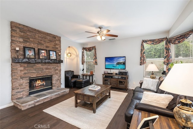 2845 Keystone Cir, Corona, CA 92882 - living room with healthy amount of natural light, a fireplace, a ceiling fan, and wood finished floors
