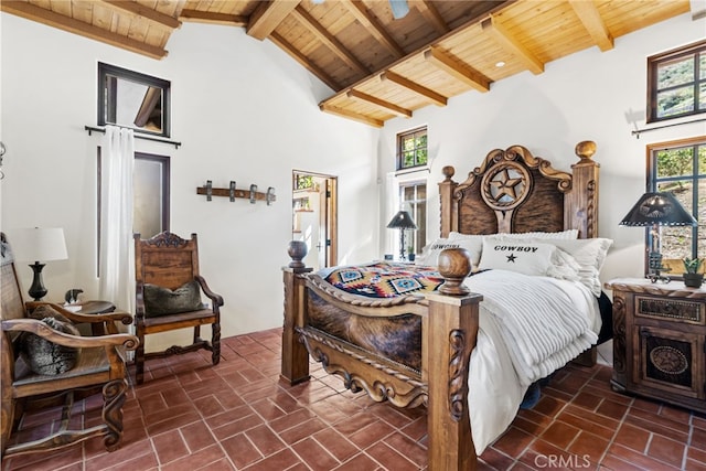 bedroom with brick floor, high vaulted ceiling, beam ceiling, and wood ceiling