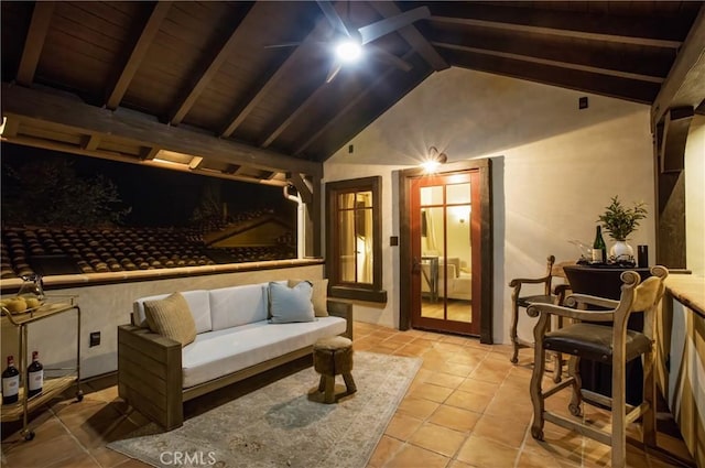 interior space featuring lofted ceiling with beams and light tile patterned floors