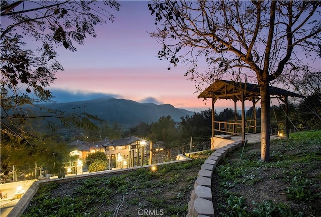yard at dusk with a mountain view