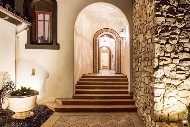 staircase with arched walkways