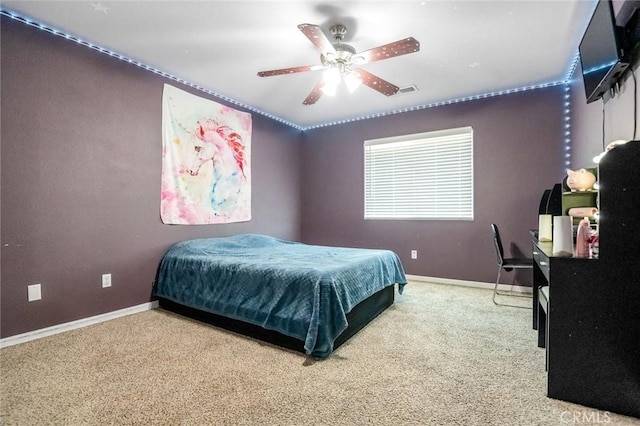 bedroom featuring carpet flooring, baseboards, and ceiling fan
