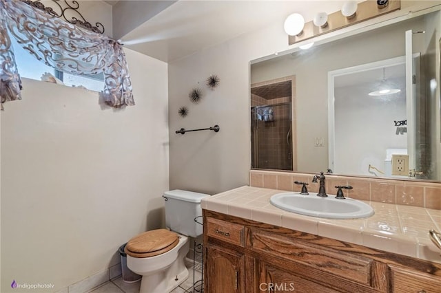 6351 Deacon Ave, Bakersfield, CA 93307 - full bath with vanity, toilet, tile patterned flooring, and tiled shower