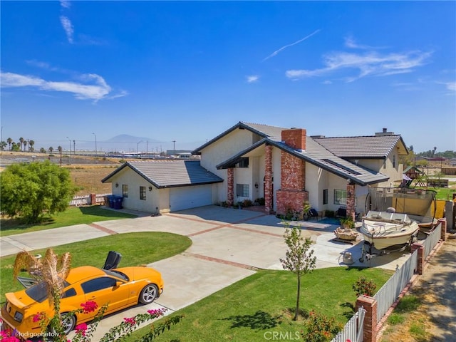 6351 Deacon Ave, Bakersfield, CA 93307 - view of front of property featuring stucco siding, driveway, a front yard, and fence