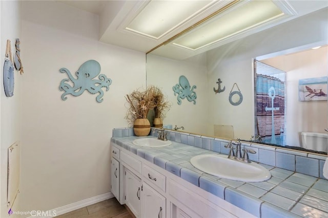 6351 Deacon Ave, Bakersfield, CA 93307 - full bath featuring a sink, baseboards, and double vanity