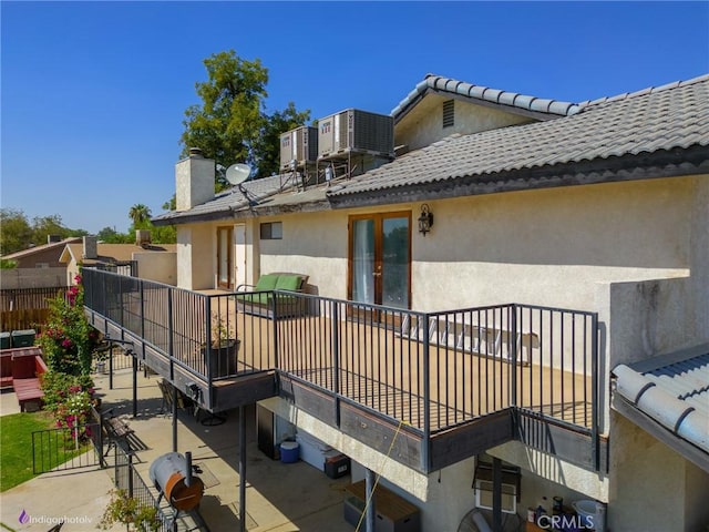 6351 Deacon Ave, Bakersfield, CA 93307 - back of house featuring a patio, central AC, and stucco siding