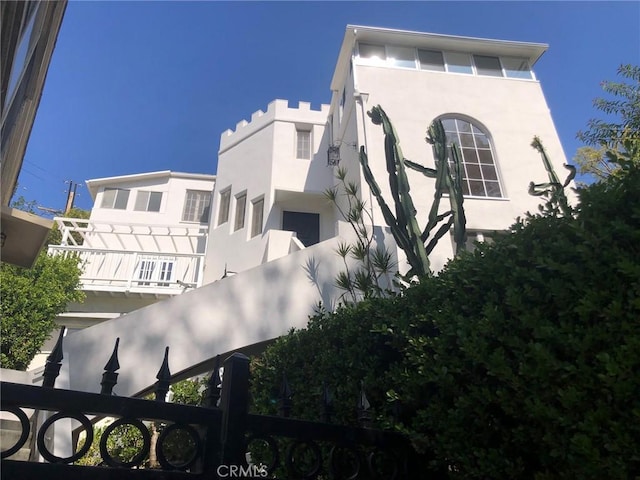 view of side of property featuring stucco siding