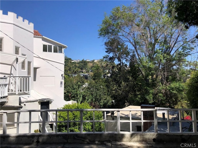 exterior space with stucco siding and a tiled roof