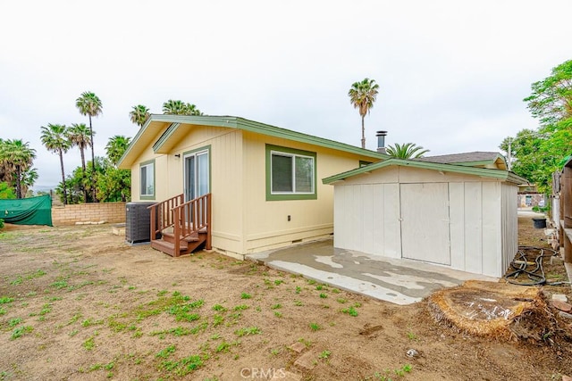1357 Mount Shasta St, Perris, CA 92570 - rear view of house with central AC unit, crawl space, and entry steps