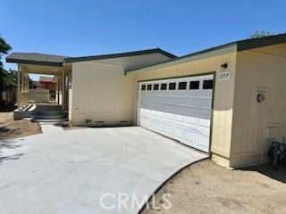 1357 Mount Shasta St, Perris, CA 92570 - view of home's exterior featuring an attached garage and concrete driveway