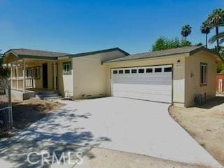 1357 Mount Shasta St, Perris, CA 92570 - ranch-style home featuring a garage, concrete driveway, and stucco siding
