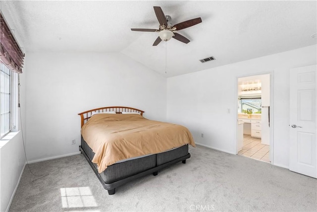 42851 Lemonwood Dr, Lancaster, CA 93536 - bedroom featuring carpet flooring, lofted ceiling, connected bathroom, and ceiling fan