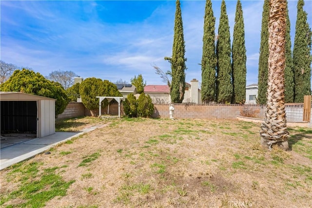 42851 Lemonwood Dr, Lancaster, CA 93536 - fenced backyard featuring a storage unit