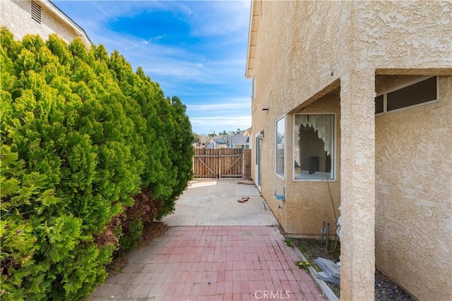 42851 Lemonwood Dr, Lancaster, CA 93536 - view of patio / terrace with a gate