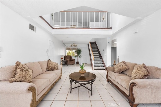 42851 Lemonwood Dr, Lancaster, CA 93536 - living area featuring a towering ceiling, stairway, and light tile patterned floors