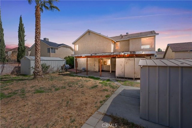 42851 Lemonwood Dr, Lancaster, CA 93536 - back of property with a shed and a patio area