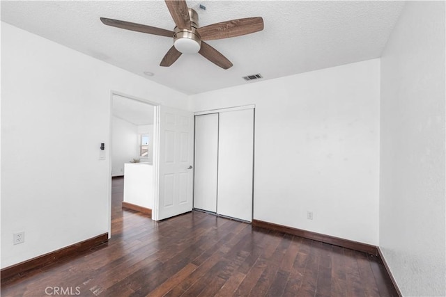 42851 Lemonwood Dr, Lancaster, CA 93536 - unfurnished bedroom featuring hardwood / wood-style floors, a closet, ceiling fan, and a textured ceiling