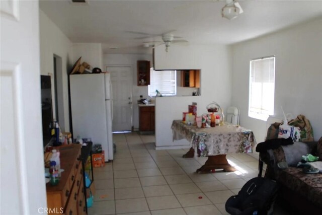 241 Hull Ave, Madera, CA 93638 - kitchen featuring light tile patterned floors, ceiling fan, and freestanding refrigerator