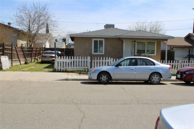 241 Hull Ave, Madera, CA 93638 - bungalow-style home with a fenced front yard
