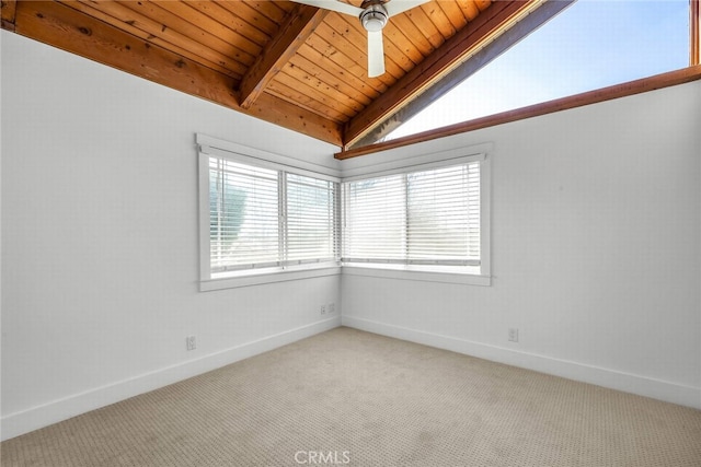 carpeted spare room with wood ceiling, lofted ceiling with beams, and baseboards
