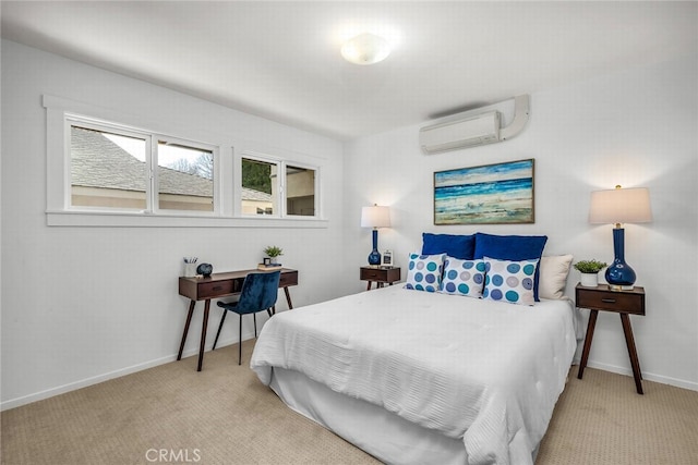 bedroom with a wall mounted AC, baseboards, and carpet floors