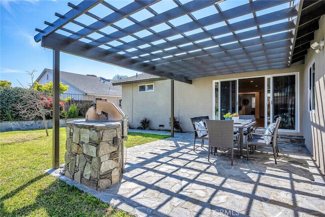 view of patio / terrace featuring outdoor dining area, a pergola, and an outdoor kitchen