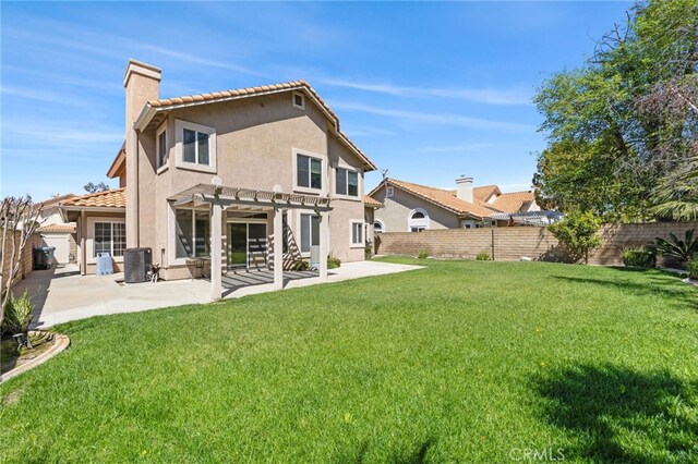 back of house with a pergola, a patio, stucco siding, a chimney, and central air condition unit