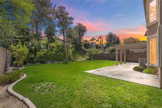 view of yard featuring a patio, central AC, a fenced backyard, and a pergola