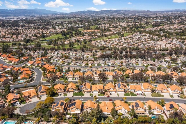 drone / aerial view featuring a residential view and a mountain view