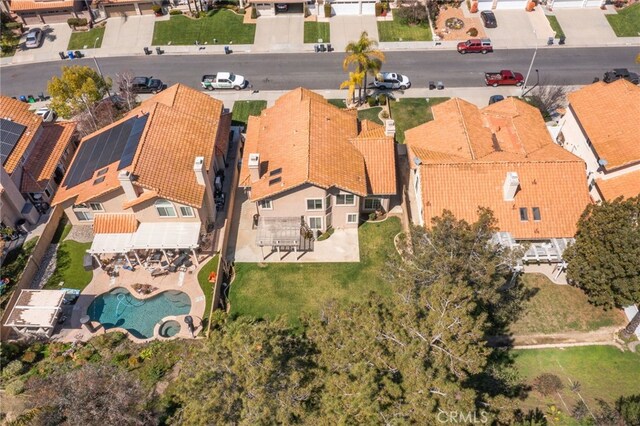 birds eye view of property with a residential view