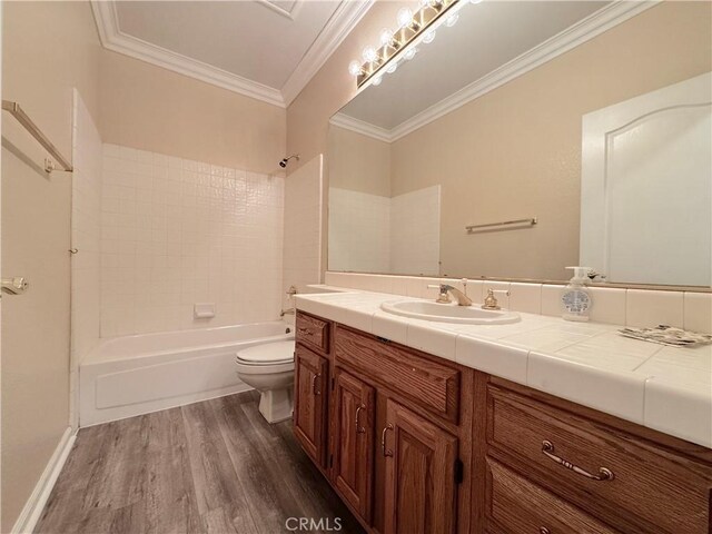 bathroom with crown molding, shower / tub combination, vanity, toilet, and wood finished floors