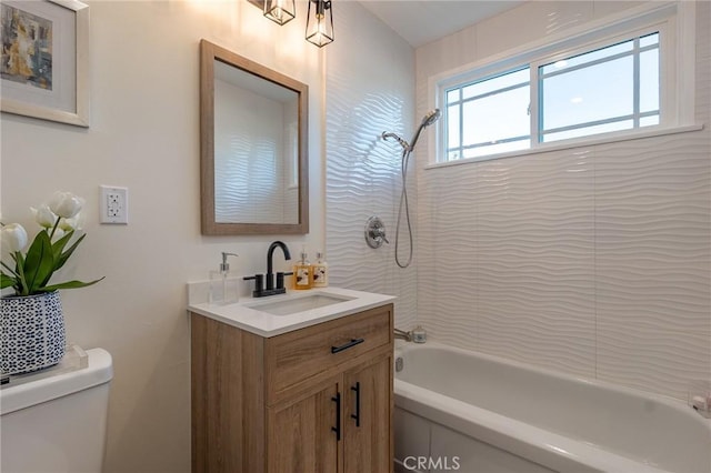 bathroom with toilet, vanity, and bathtub / shower combination