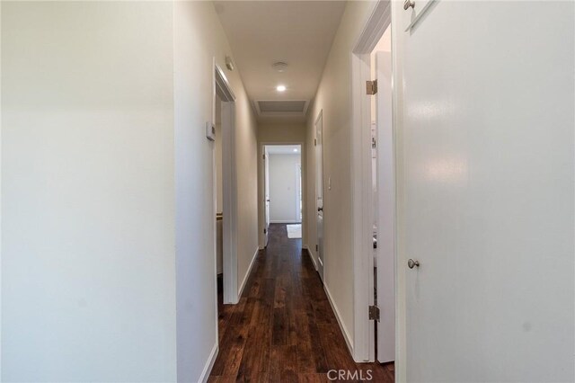 20101 Superior St, Chatsworth, CA 91311 - hallway with baseboards, attic access, and dark wood-type flooring