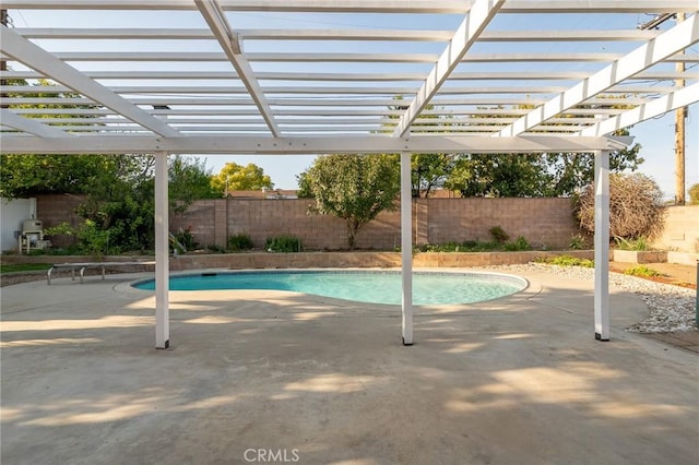 view of pool with a patio, a pergola, a fenced backyard, and a fenced in pool