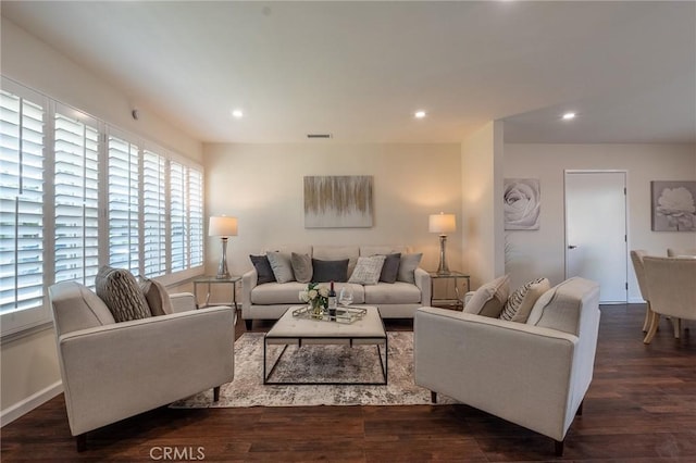 living area featuring recessed lighting, dark wood-style flooring, baseboards, and visible vents